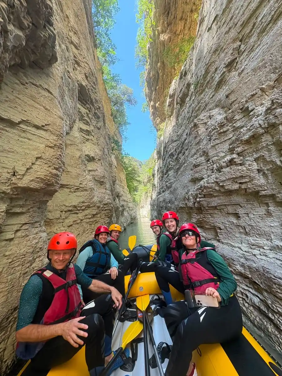 Raft passing through one of the narrowest slot sections of Osum Canyon