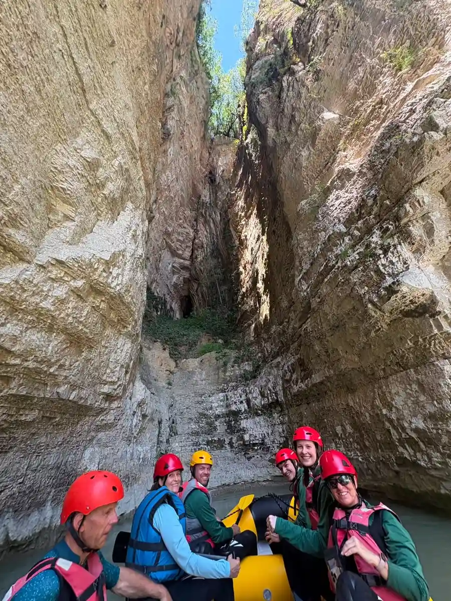 Raft approaching a dramatic narrow side-gorge opening in Osum Canyon